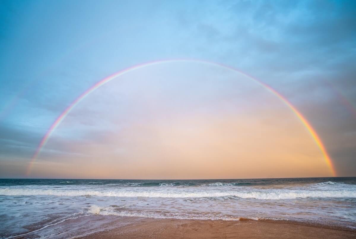 a rainbow visible from the coast