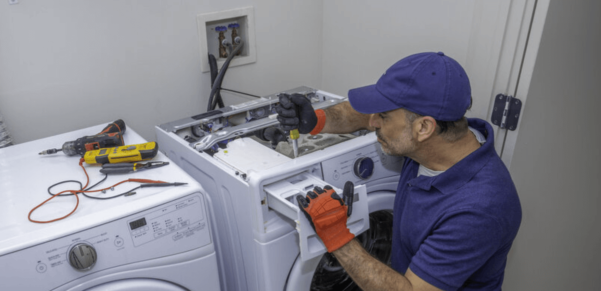repairman fixing washing machine